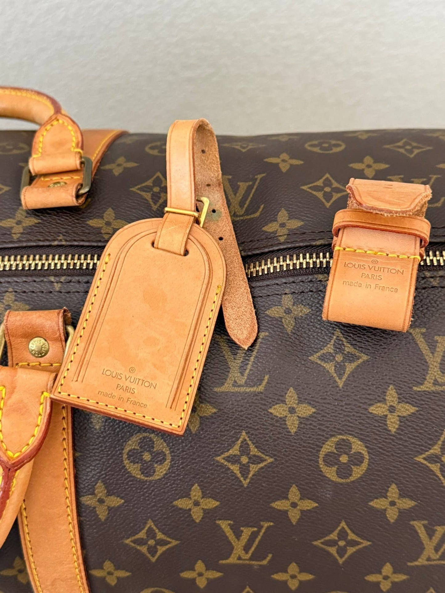 Keepall 60 Bandoulier with Original Strap, Luggage Tag and Poignet 📅 Year: 1991