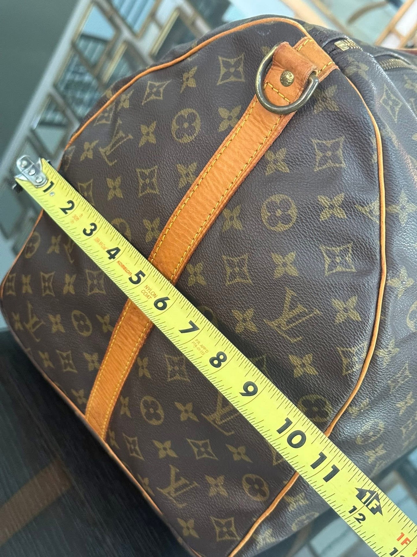Keepall 60 Bandoulier with Original Strap, Luggage Tag and Poignet 📅 Year: 1991